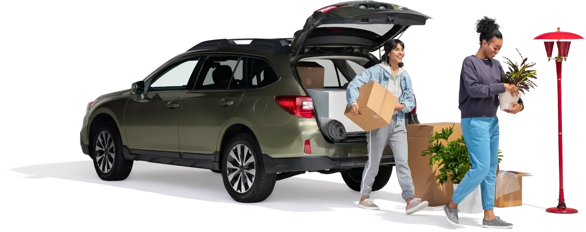 A mother and daughter remove household items from their SUV.